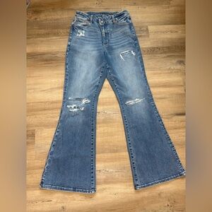 Curvy high rise flared distressed blue jeans